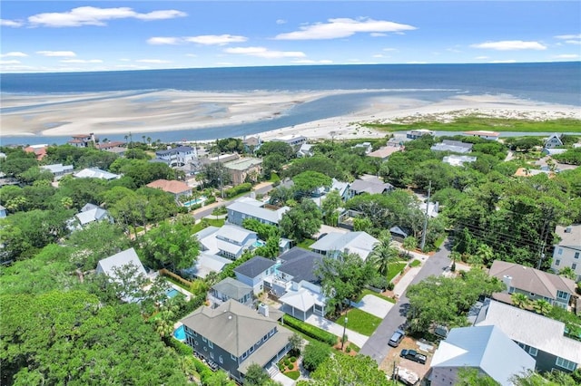 birds eye view of property featuring a view of the beach and a water view