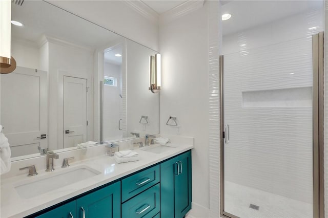 bathroom with vanity, a shower with door, and crown molding