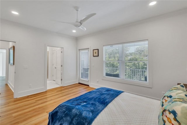 bedroom with ceiling fan, crown molding, and hardwood / wood-style flooring