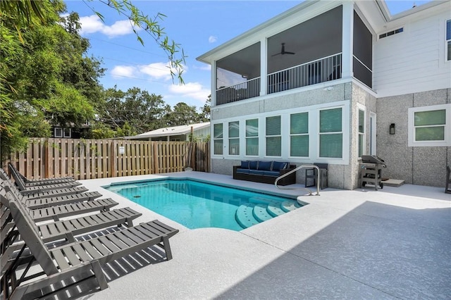 view of pool with a grill, ceiling fan, and a patio