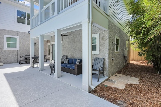 exterior space with a balcony and an outdoor hangout area