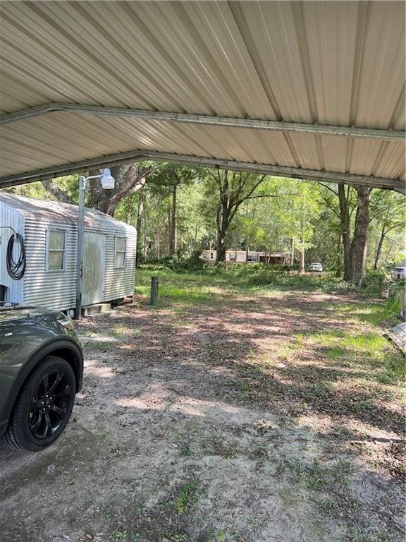 view of yard with a carport