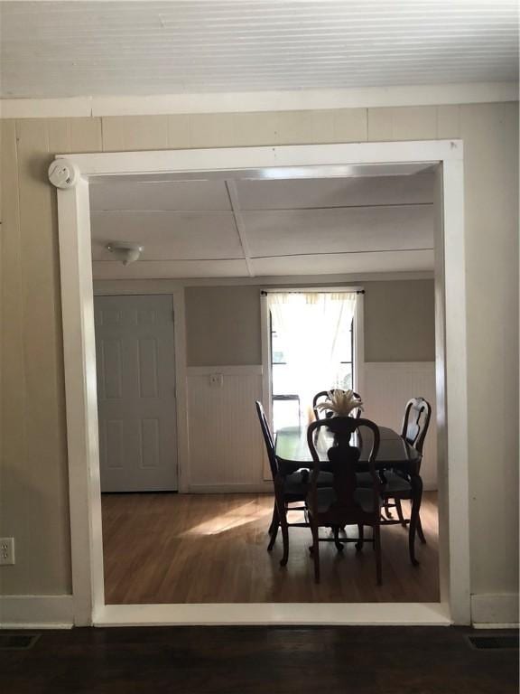 6644 New Jesup Hwy, Brunswick, GA 31523 - dining space featuring wood finished floors and a wainscoted wall