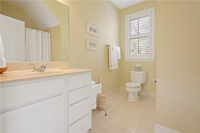 bathroom with curtained shower, toilet, vanity, baseboards, and tile patterned floors