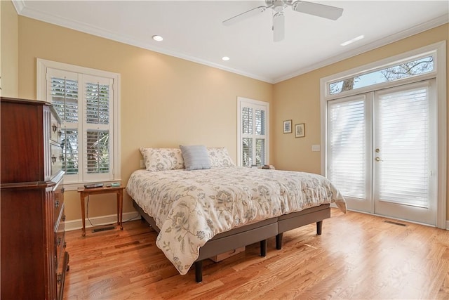 bedroom with access to exterior, visible vents, light wood-style flooring, ornamental molding, and baseboards