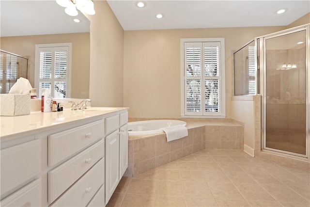 bathroom featuring a garden tub, recessed lighting, a shower stall, vanity, and tile patterned floors