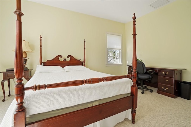 carpeted bedroom featuring visible vents