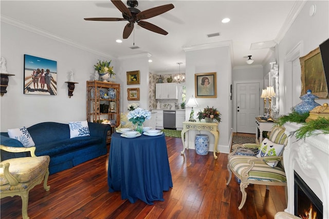 living room featuring crown molding, dark hardwood / wood-style flooring, and ceiling fan with notable chandelier