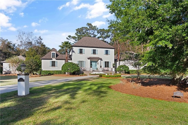 view of front of home with a front yard