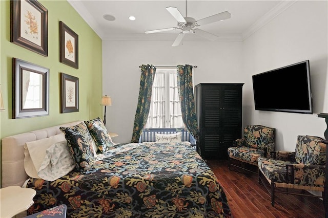 bedroom featuring dark hardwood / wood-style floors, multiple windows, ornamental molding, and ceiling fan