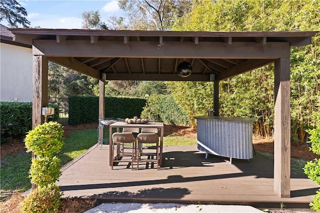 wooden terrace featuring a gazebo