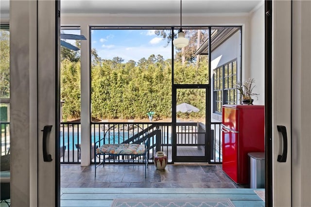 entryway featuring french doors and ornamental molding