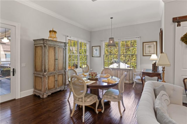 dining room with plenty of natural light, dark hardwood / wood-style flooring, and crown molding