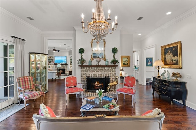 living room with ceiling fan, dark hardwood / wood-style flooring, crown molding, and a brick fireplace