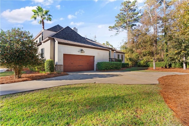 view of property exterior featuring a yard and a garage