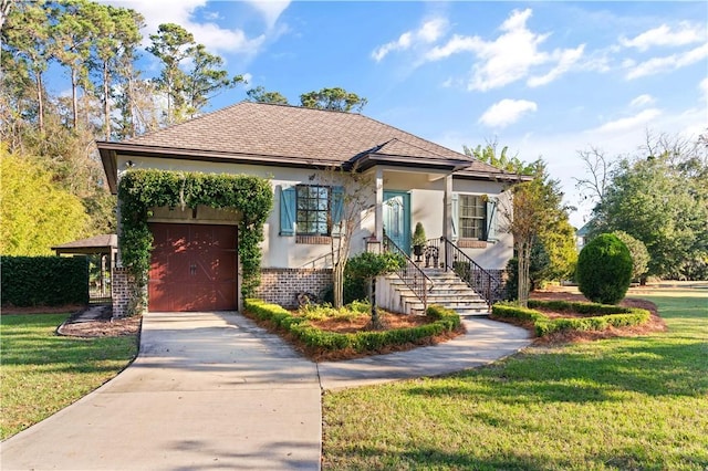 view of front of home with a garage and a front yard