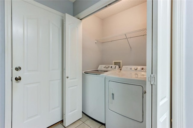 30 Bridgewater Way, Brunswick, GA 31525 - clothes washing area featuring washer and clothes dryer and light tile patterned floors