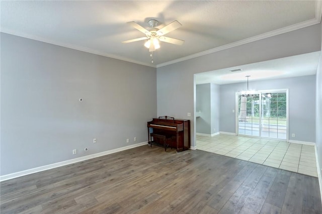 30 Bridgewater Way, Brunswick, GA 31525 - unfurnished room with a ceiling fan, wood finished floors, ornamental molding, baseboards, and a chandelier