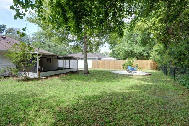 30 Bridgewater Way, Brunswick, GA 31525 - view of yard featuring a sunroom and a patio area