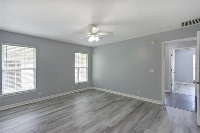 30 Bridgewater Way, Brunswick, GA 31525 - unfurnished room with a ceiling fan, wood finished floors, and baseboards