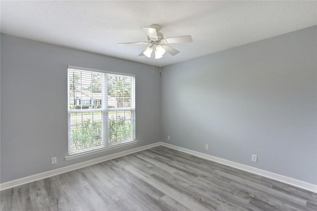 30 Bridgewater Way, Brunswick, GA 31525 - unfurnished room featuring a ceiling fan, wood finished floors, and baseboards