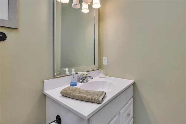 bathroom with vanity and an inviting chandelier