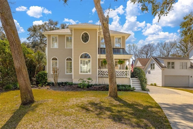 view of front facade with a porch and a front lawn