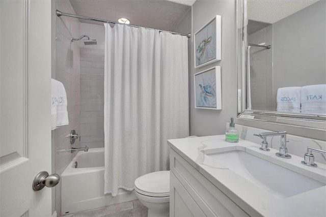 bathroom featuring vanity, toilet, shower / bath combo, and a textured ceiling