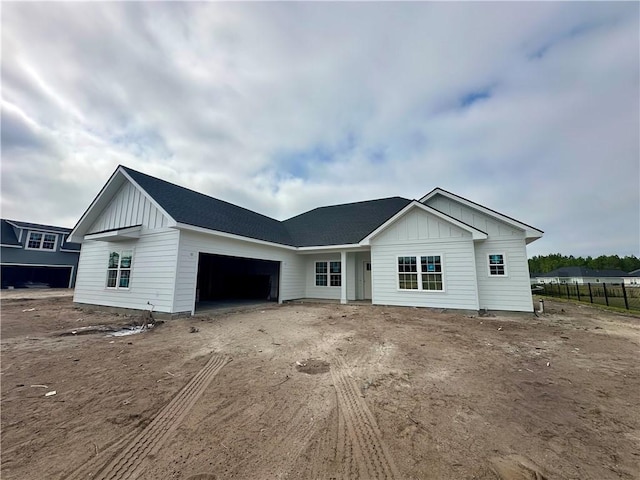 188 Allie Loop, Brunswick, GA 31525 - view of front of house featuring board and batten siding and a garage