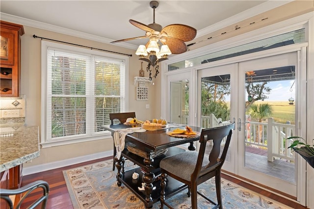 dining area featuring plenty of natural light, dark hardwood / wood-style floors, ceiling fan, and french doors