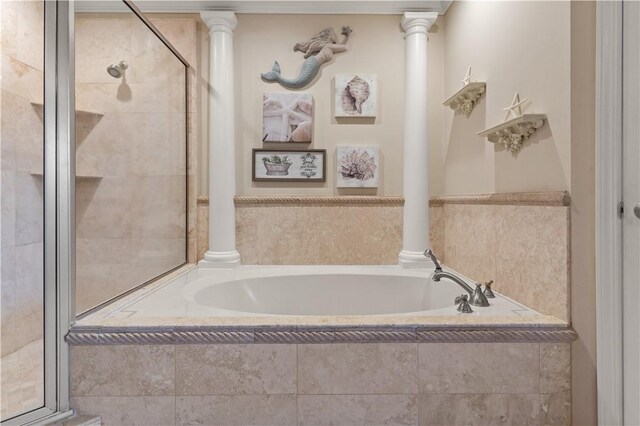 bathroom featuring shower with separate bathtub