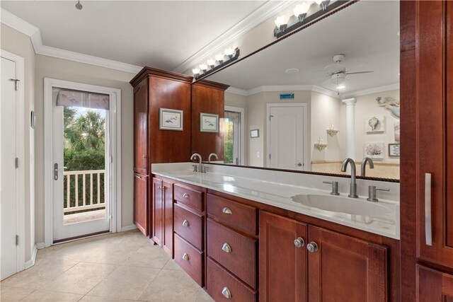 bathroom featuring tile patterned flooring, ceiling fan, crown molding, and vanity