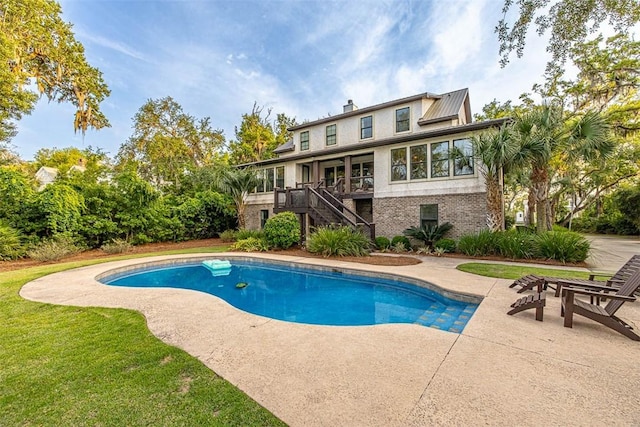 view of swimming pool with a patio area