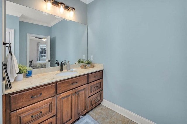 bathroom with tile patterned flooring, vanity, ceiling fan, and crown molding