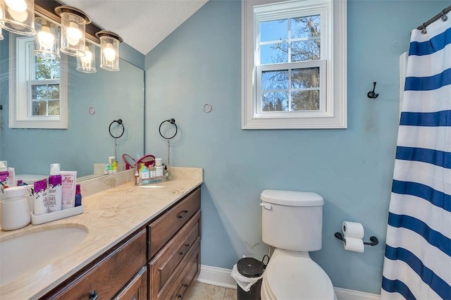 bathroom featuring walk in shower, tile patterned floors, vaulted ceiling, toilet, and vanity