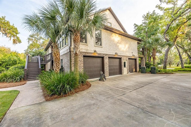 view of side of property featuring a garage