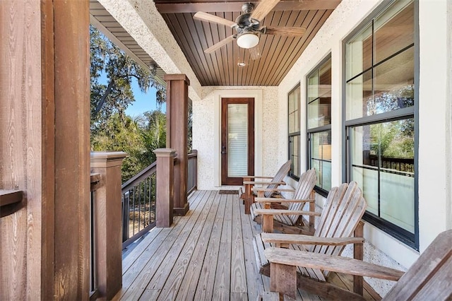 wooden deck featuring ceiling fan