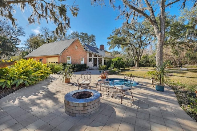 view of patio with a fire pit