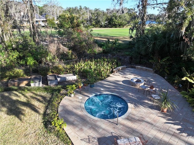 view of pool with an in ground hot tub and a patio area