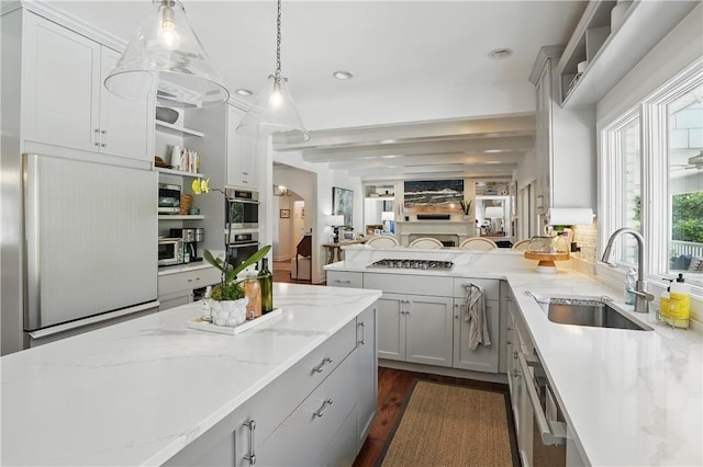 184 Merion, Saint Simons Island, GA 31522 - kitchen with a sink, appliances with stainless steel finishes, hanging light fixtures, gray cabinetry, and open shelves