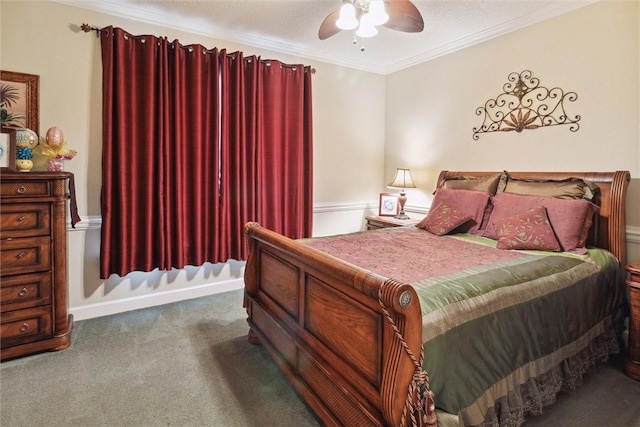 bedroom featuring dark colored carpet, ceiling fan, and ornamental molding