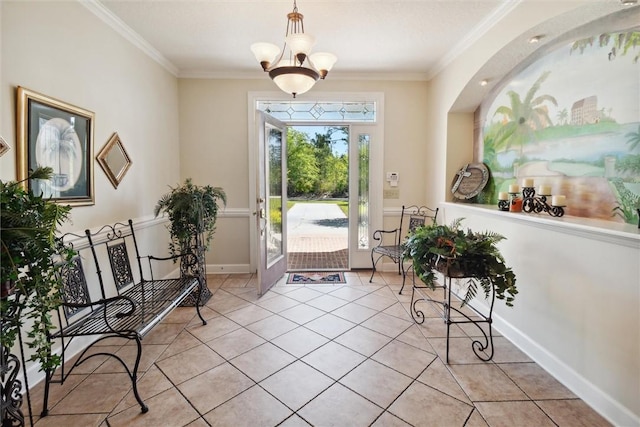 entrance foyer featuring light tile patterned flooring, ornamental molding, and an inviting chandelier