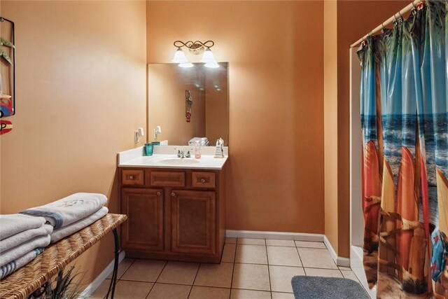 bathroom with vanity, tile patterned floors, and walk in shower