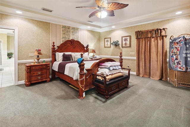 carpeted bedroom with ceiling fan and ornamental molding