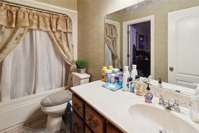 full bathroom with shower / bath combo with shower curtain, vanity, and toilet