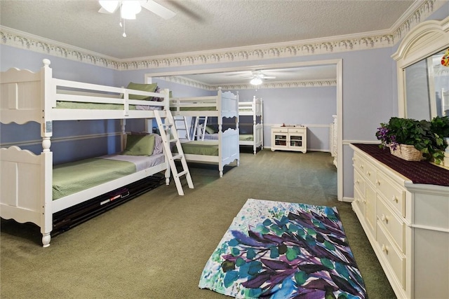 carpeted bedroom featuring a textured ceiling, ceiling fan, and crown molding