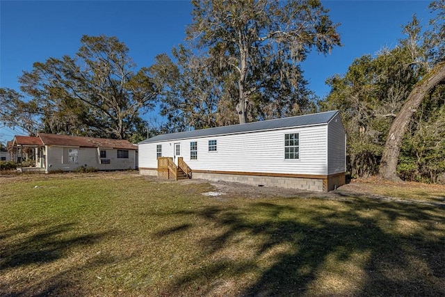 back of house with a yard