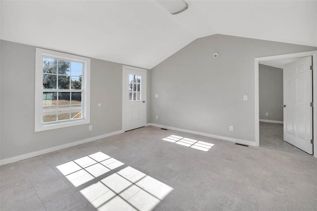 empty room with lofted ceiling