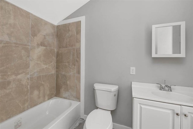 full bathroom with washtub / shower combination, vaulted ceiling, vanity, and toilet