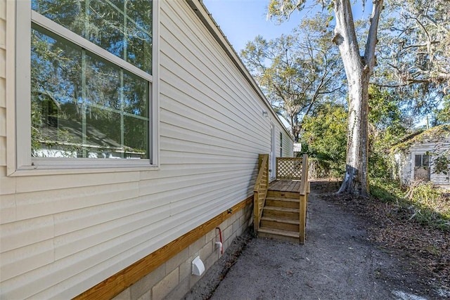 view of side of home with a water view